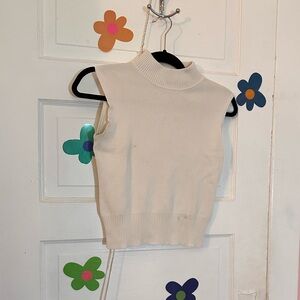 White sleeveless turtleneck